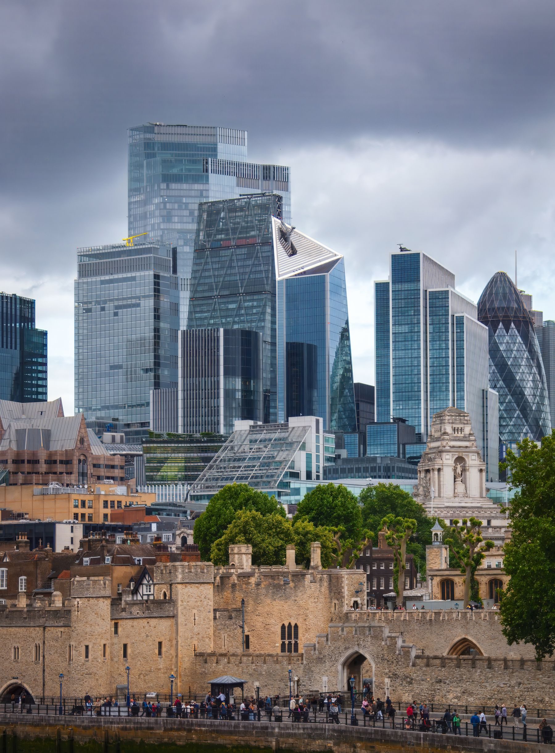 Modern towers standing beside historic buildings in London